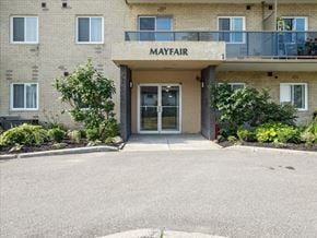 Barrie apartment for rent - The front of a building with the word "Mayfair" on it.