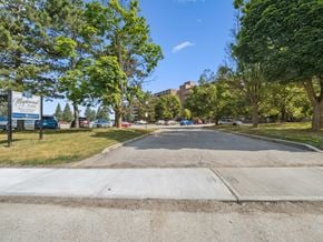 Barrie apartment for rent - A street view with a sign that says "Magnolia" on it.