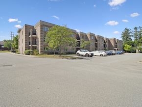 Barrie apartment for rent - A parking lot in front of apartment buildings.