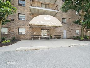 Orillia apartment for rent - The entrance to a building with a sign that reads "Coldwater Road".