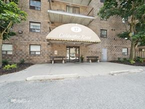 Orillia apartment for rent - The entrance to a building with a sign that reads "Coldwater Road".