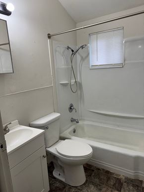 Lima house for rent - A white toilet is next to a sink in a bathroom.