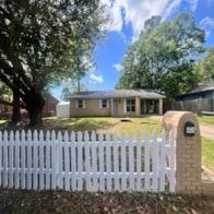 Moss Point house for rent - A white picket fence in front of a house.