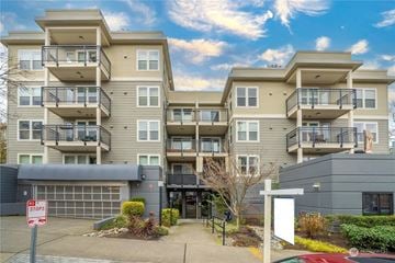 Seattle apartment for rent - A large apartment complex with a stop sign in front.