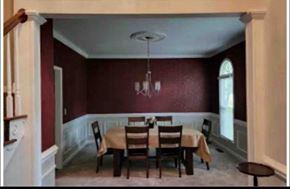 Kernersville house for rent - A dining room with a table set for four.