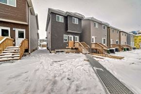 Edmonton apartment for rent - A snowy scene with apartment buildings and a pathway.