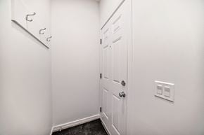 Edmonton apartment for rent - A white door is closed with a black handle.