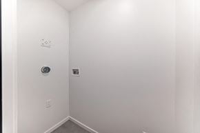 Edmonton apartment for rent - A white wall with a switch and a socket.