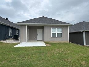 Little Rock house for rent - A house with a grey roof and a white door.