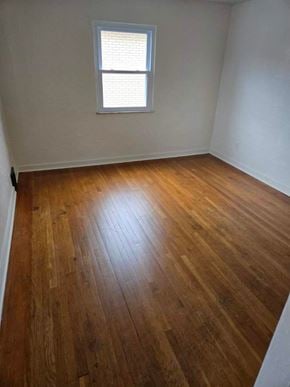 Clairton house for rent - A room with wooden flooring and a window.