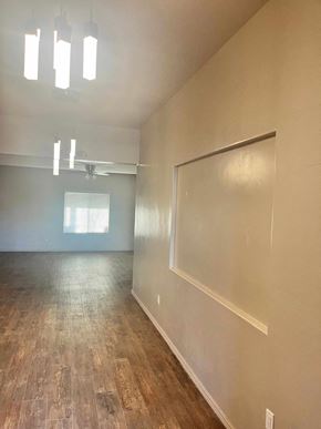Washington house for rent - A room with wooden flooring and a window with blinds.