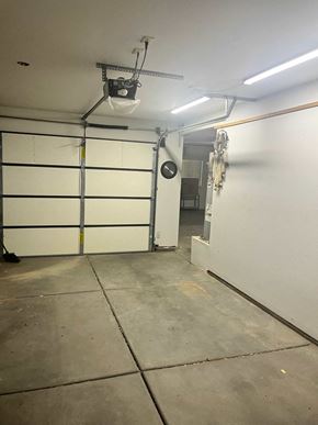 Washington house for rent - A garage with a white wall and a white door.