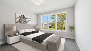 Blaine house for rent - A bedroom with a large bed and a painting on the wall.