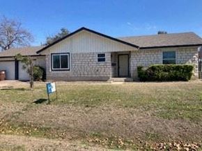 Round Rock house for rent - A house with a sign in front of it.