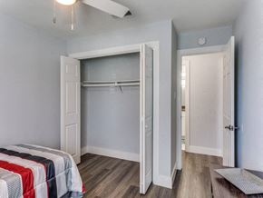 Killeen apartment for rent - A bedroom with a bed and a closet.