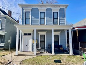Louisville apartment for rent - A blue house with white trim and a porch.