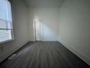 Louisville apartment for rent - A room with a door and a window.