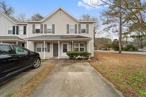 Jacksonville house for rent - A two-story house with a black car parked in front.