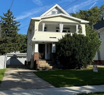 Lakewood apartment for rent - A two-story house with a front porch and a garage.