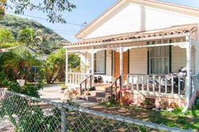 Santa Barbara house for rent - A house with a white fence in front of it.