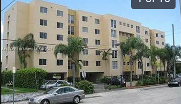 Miami apartment for rent - A building with a car parked in front of it.