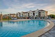 Melbourne apartment for rent - A large swimming pool in front of a residential building at Mode at Melbourne, LLC Apartments, Melbourne, FL, 32901