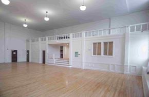 Bath apartment for rent - A large empty room with wooden floors and white walls.
