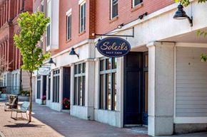 Exeter apartment for rent - A tree stands in front of a Sobeir's Salt Cave storefront.