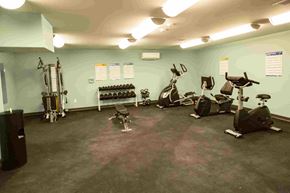 Old Orchard Beach apartment for rent - A gym with a variety of exercise equipment including treadmills, stationary bikes, and weight machines.