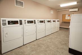 Old Orchard Beach apartment for rent - A row of white washing machines in a laundry room.
