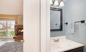 Fort Collins apartment for rent - A bathroom with a white sink and a mirror.