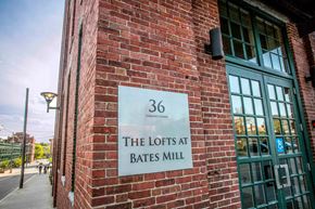 Lewiston apartment for rent - A sign on a brick wall that says