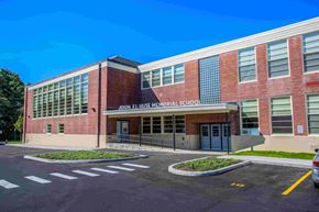 Bath apartment for rent - John F. Kennedy Memorial School is a red brick building with a parking lot in front.