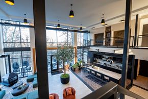 Columbus apartment for rent - A modern interior space with a bar and seating area.