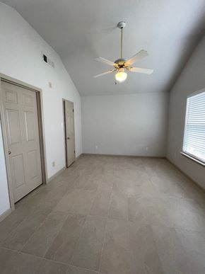 Temple house for rent - A room with a ceiling fan and tile flooring.