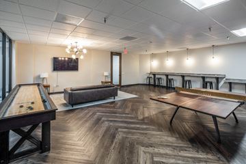 Houston apartment for rent - A room with a pool table and a couch.