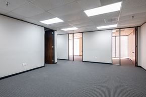 Houston apartment for rent - A room with a white wall and a carpeted floor.