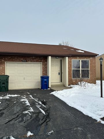 Galloway apartment for rent - A house with a brown roof and a white garage door.