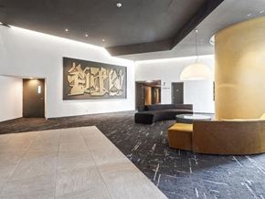 Verdun apartment for rent - A large artwork hangs on the wall in a modern room.