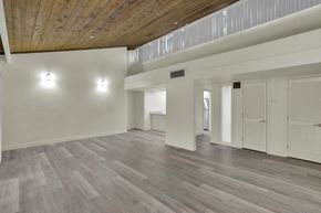 Haines City apartment for rent - Spacious open-plan living area with hardwood flooring and abundant natural light.