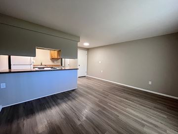Littleton apartment for rent - A kitchen with a counter and cabinets is visible in the image.
