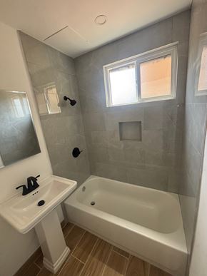Los Angeles apartment for rent - A bathroom with a white sink and a white bathtub.