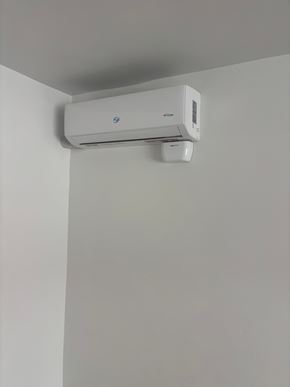 Los Angeles apartment for rent - A wall-mounted air conditioning unit is installed on a white wall.