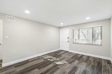 Lakewood apartment for rent - A kitchen with dark blue cabinets and a white counter.