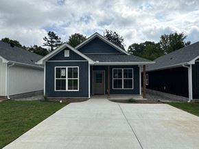 Little Rock house for rent - A house with a grey roof and a grey garage door.