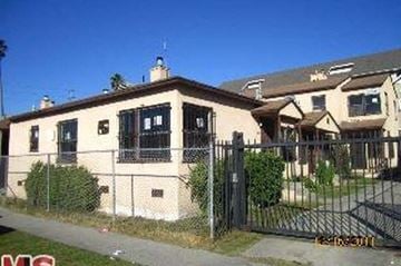 Los Angeles apartment for rent - A house with a black fence in front of it.