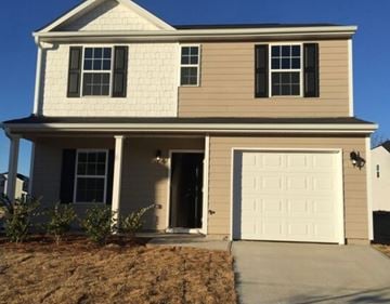Stone Mountain house for rent - A two-story house with a white garage door.
