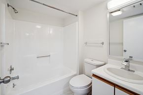 Altoona apartment for rent - A white bathroom with a toilet, sink, and bathtub.