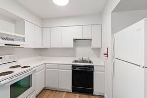 Altoona apartment for rent - A white kitchen with a stove, oven, dishwasher, and refrigerator.