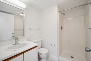 Altoona apartment for rent - A white bathroom with a sink, toilet, and bathtub.